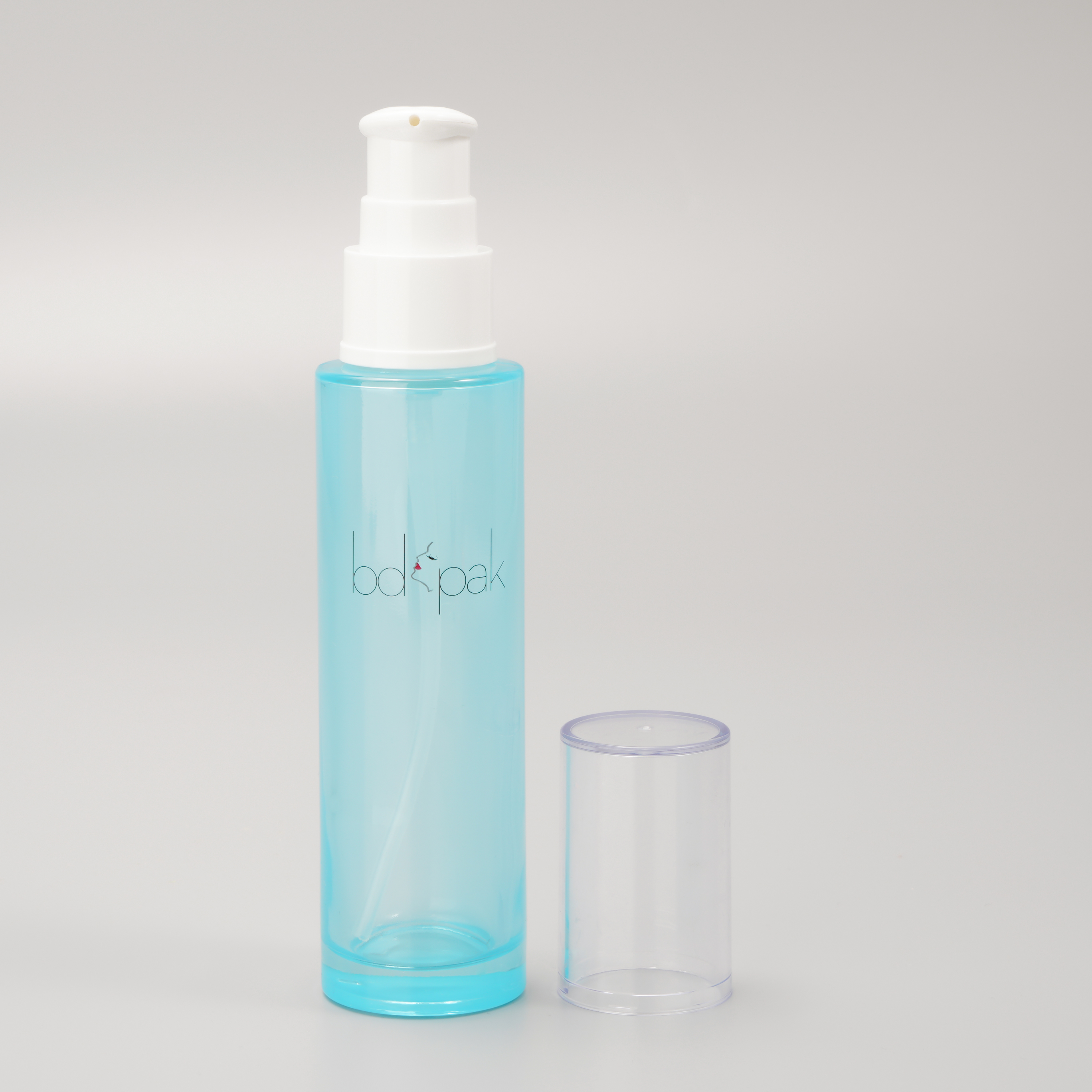 blue glass bottle with pump for skincare packaging