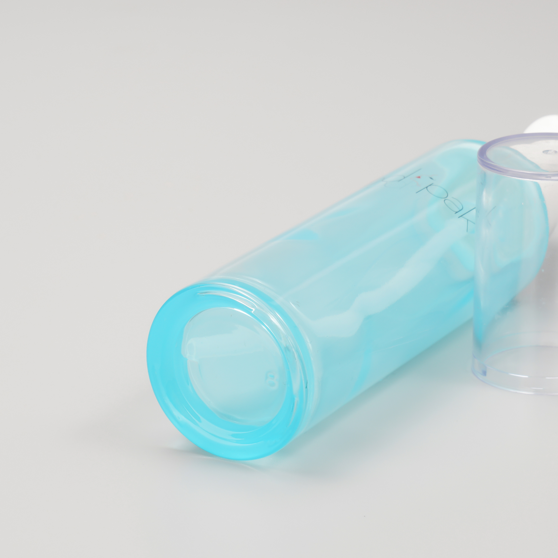 blue glass bottle with pump for skincare packaging