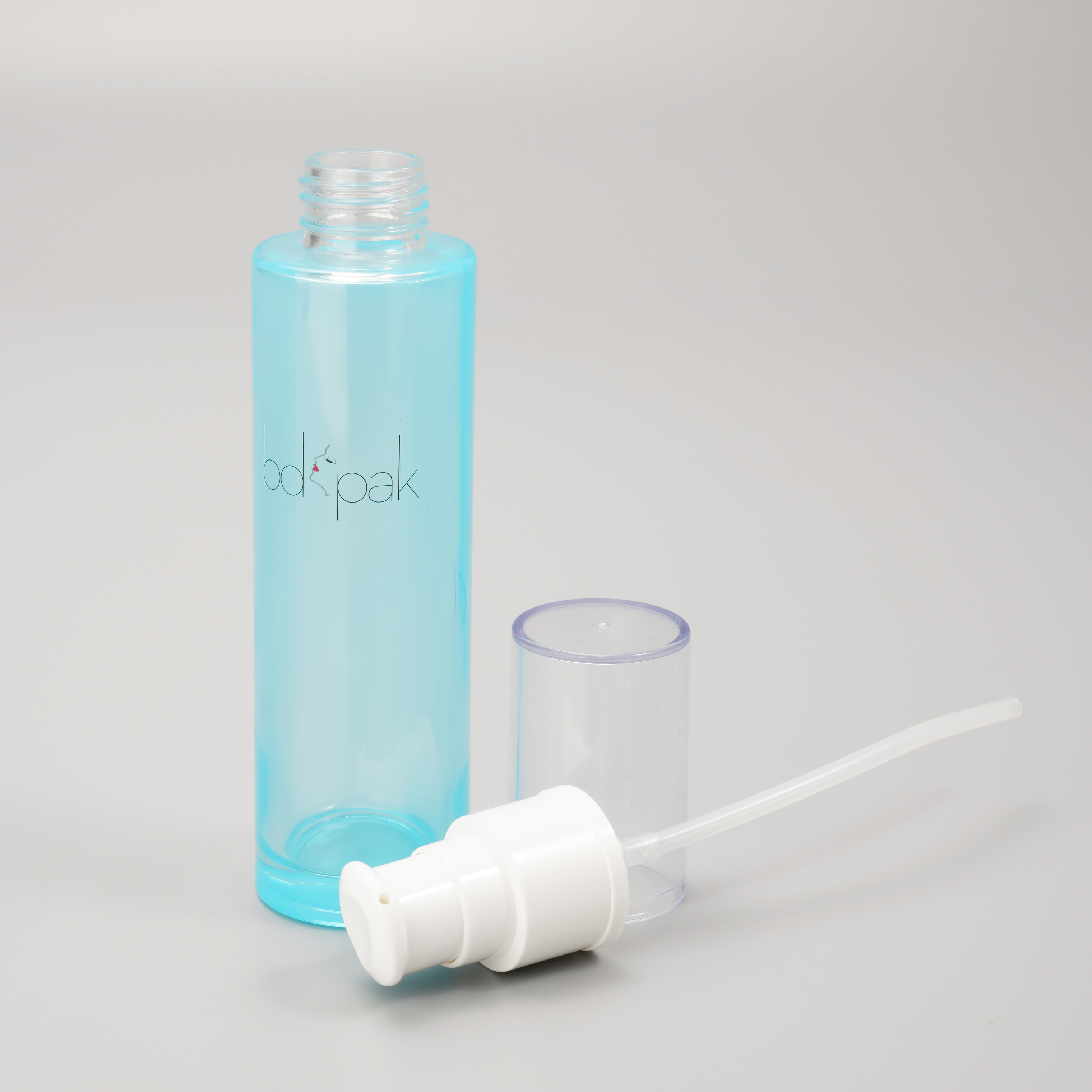 blue glass bottle with pump for skincare packaging