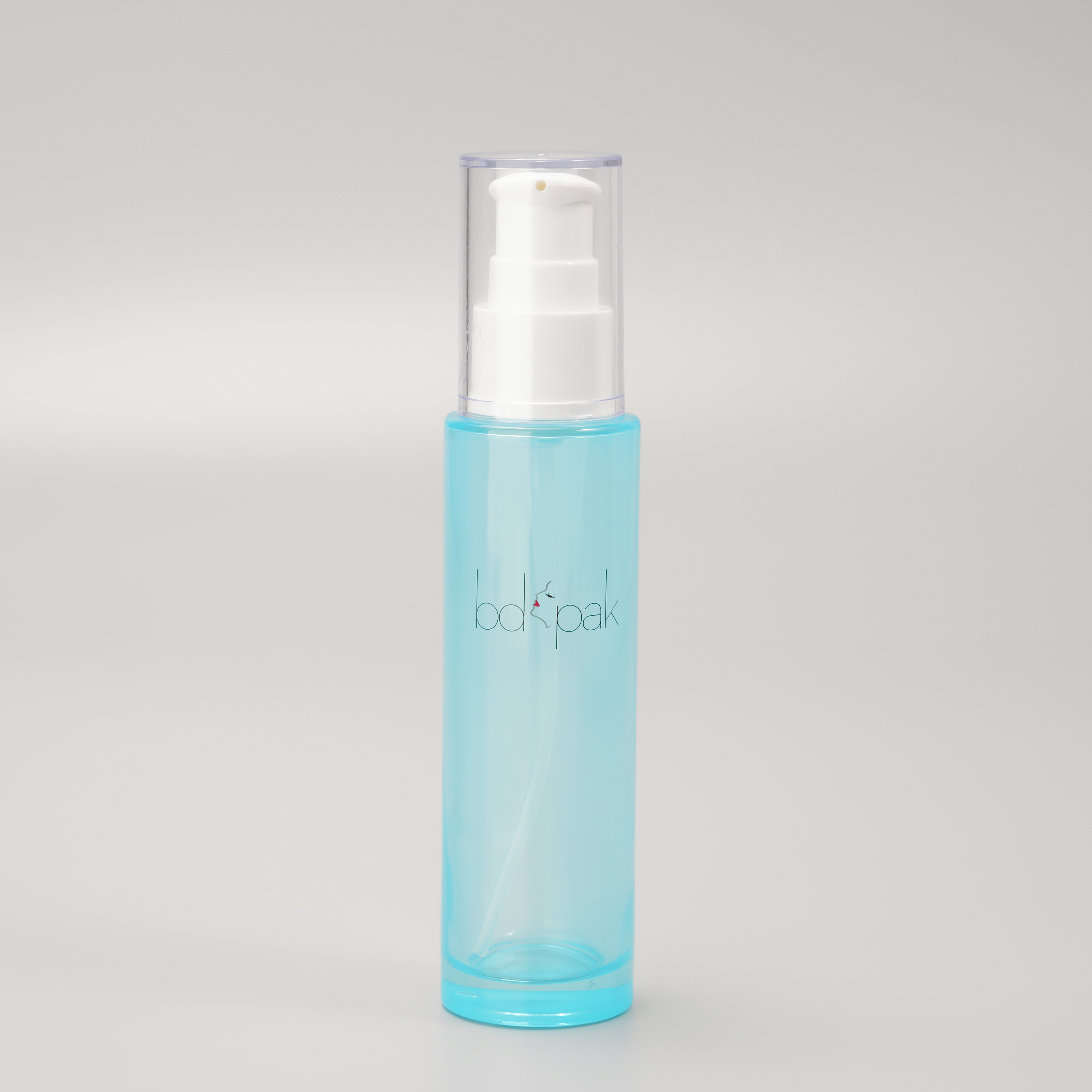 blue glass bottle with pump for skincare packaging