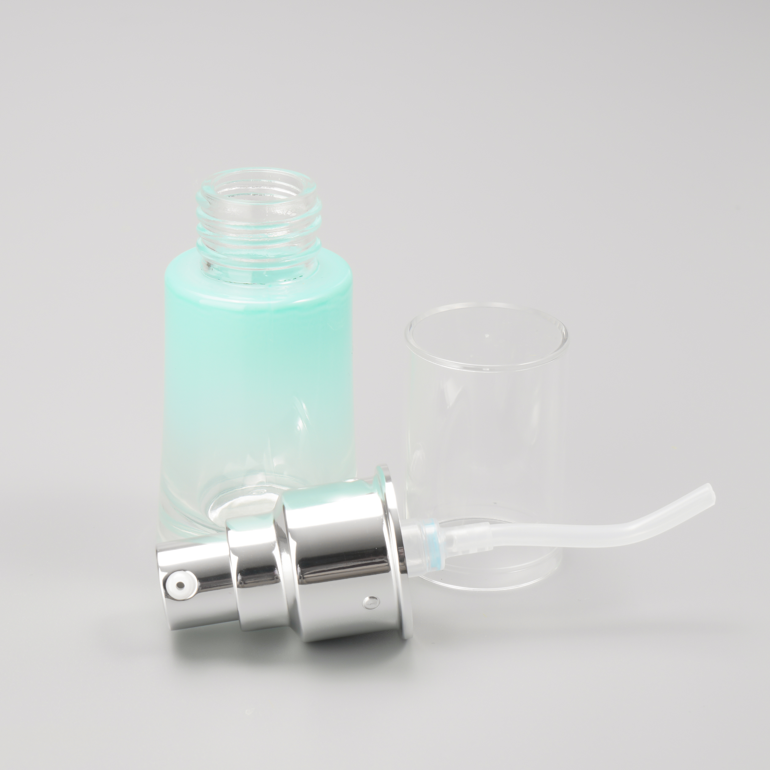 blue serum pump bottle with clear cap