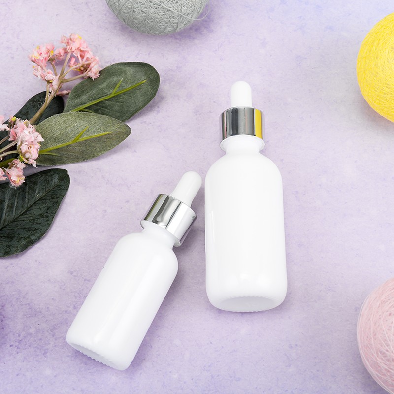 US Available Low Moq Cosmetic Face Serum Herb Hair Essential Oil Bottle 60 ml Round White 60ml Dropper Bottle with pipette